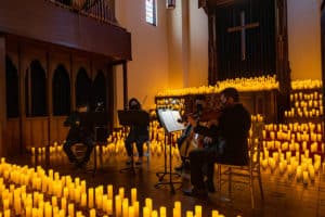 A string quartet plays in the CHAPEL venue during a Candlelight concert