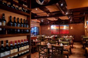 Wine selection and seating at Buon Appetito Restaurant in San Diego